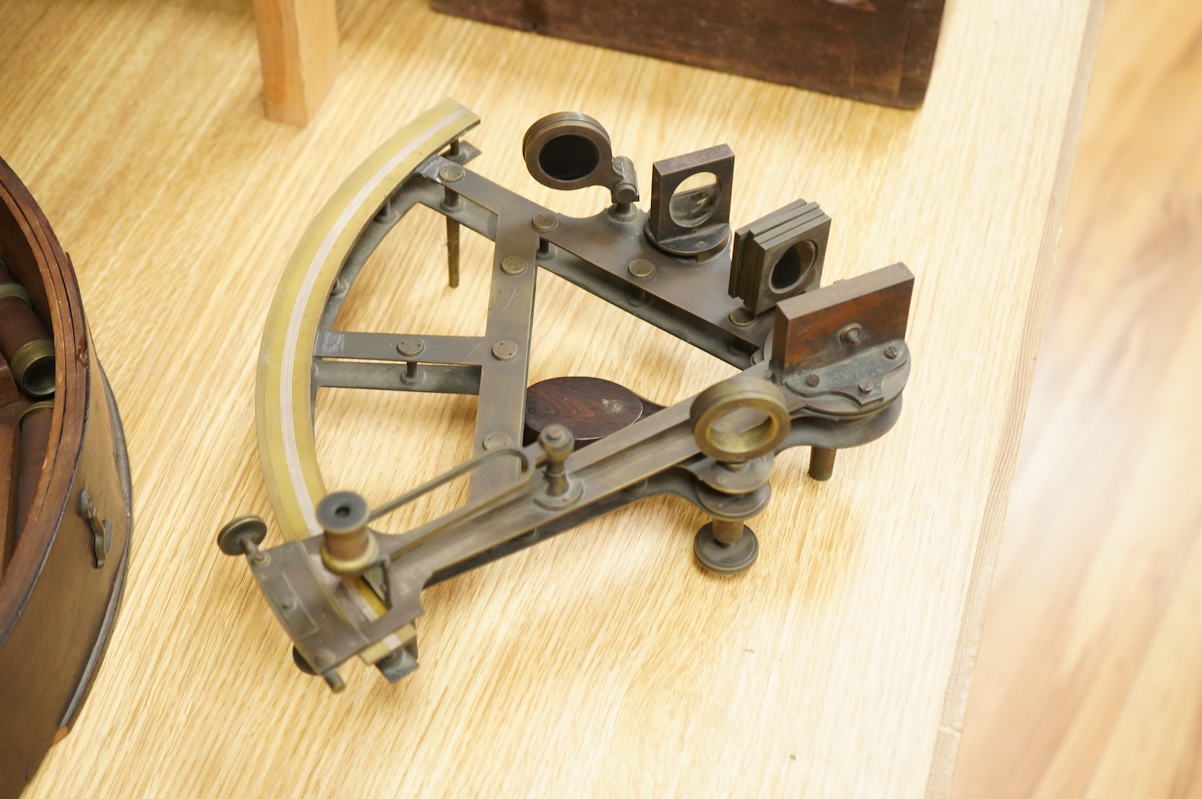A mid 19th century brass and lacquered double frame sextant, by Troughton & Sims, London, number 2367, the mahogany case containing four interchangeable sighting telescopes, two eyepieces and an adjusting key